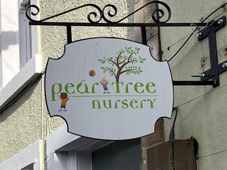 Image of sign above Pear Tree Nursery Church Street Haddington