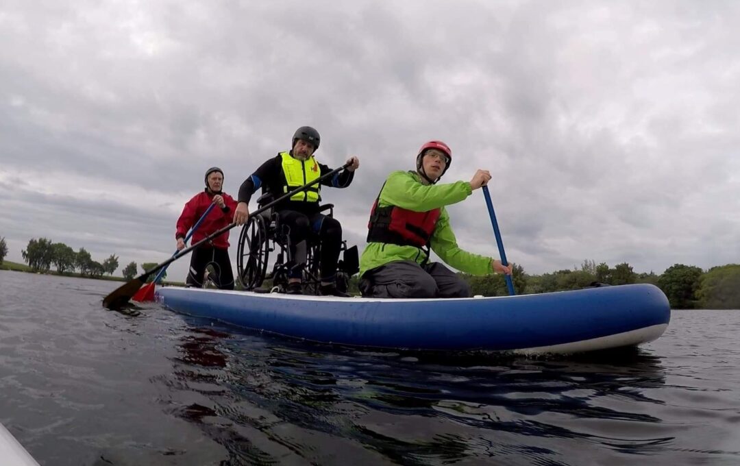 3 People rowing on a boat