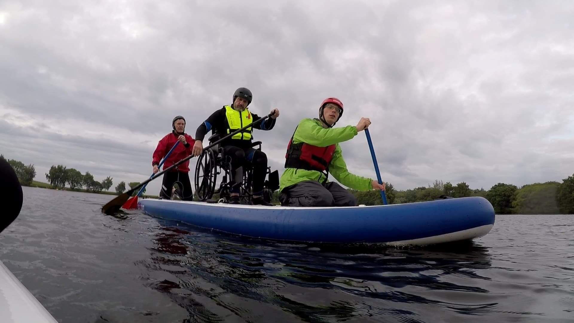 3 People rowing on a boat